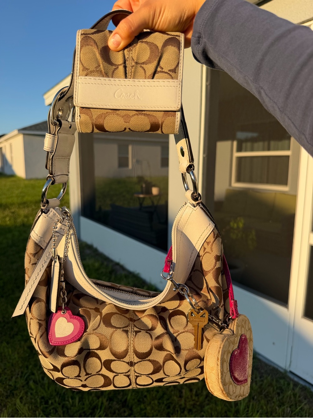Coach Signature Canvas Hobo Bag with white leather trim and matching wallet